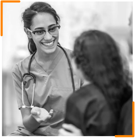 A healthcare professional engaging with a patient, providing medical assistance, symbolizing the CNK Foundation’s commitment to delivering essential medical services to underserved communities.