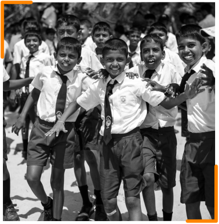 A group of school children in uniforms walking arm in arm, symbolizing unity and support in educational initiatives for special needs children.
